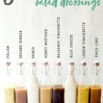 Swing-top glass bottles filled with 8 different salad dressings. Text labels above each bottle describe the flavor. A text overlay reads "8 Healthy Salad Dressings."