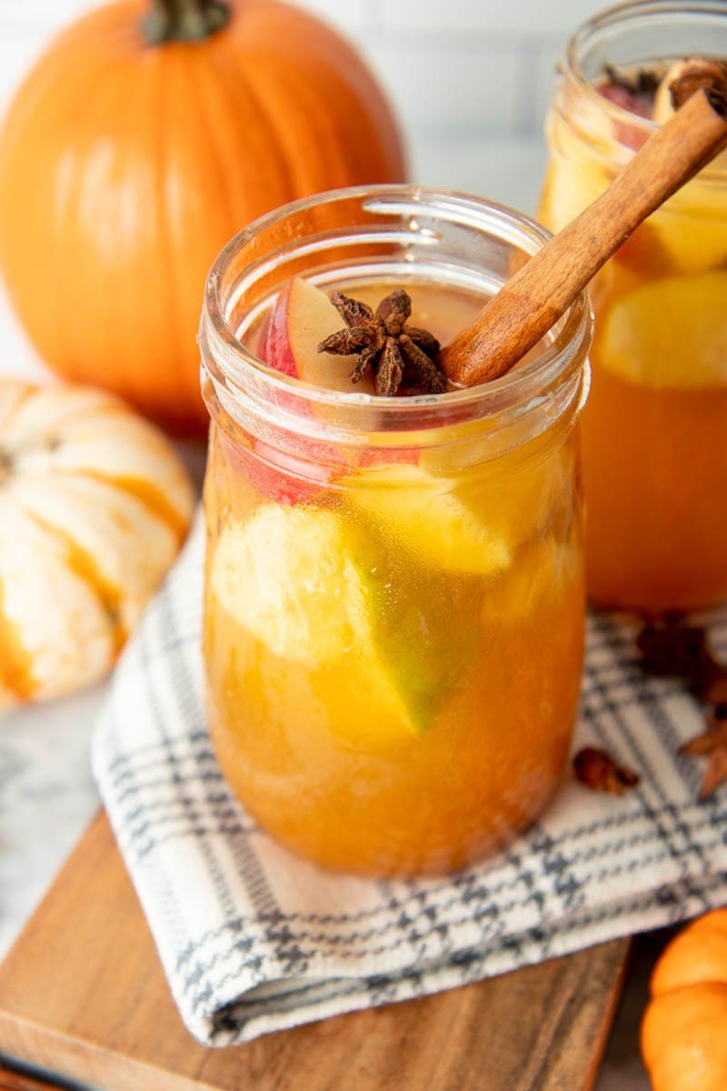 A glass of finished sangria with cinnamon stick and star anise garnish.