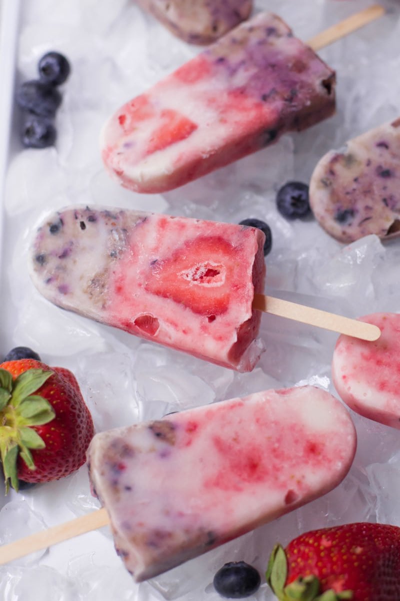 Cool off this summer with these four-ingredient swirly berry yogurt popsicles. Made with fresh berries!