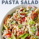 Ranch BLT Pasta Salad in a white bowl on a white background. A text overlay reads "Ranch BLT Pasta Salad"