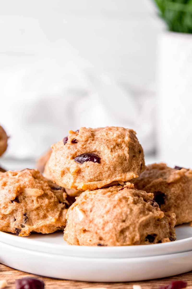 Close view of homemade fruit and nut breakfast cookies on a white plate.