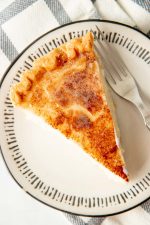 Close-up of a plated slice of hoosier sugar cream pie showing the topping.