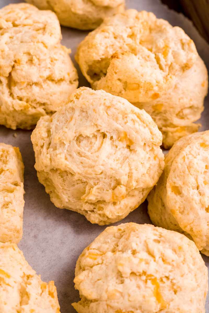 Tight view of tender, fluffy drop biscuits on a serving tray.