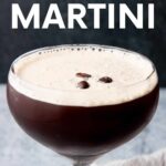 Close view of an espresso martini in a curvy coupe glass with a creamy foam and three espresso beans as garnish. A text overlay reads, "Espresso Martini."