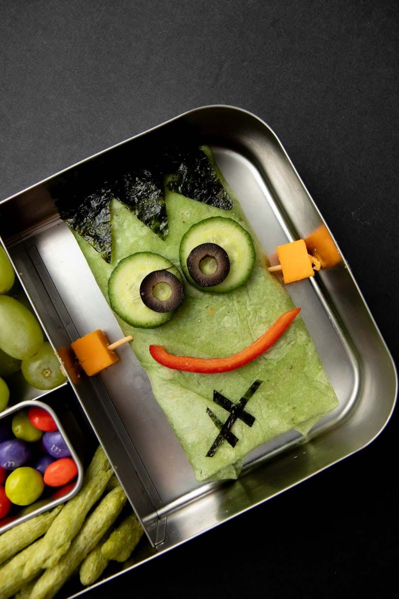 Frankenstein wrap idea with spinach tortilla and veggies slices to make a face.