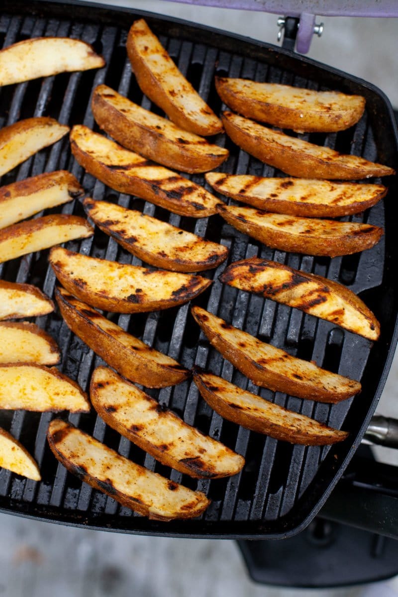 Overhead shot of Perfect Grilled Potato Wedges on a grill