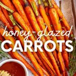 Honey glazed carrots served on a wooden tray with small bowls of honey and fresh thyme on either side. A text overlay reads, "Honey-Glazed Carrots."