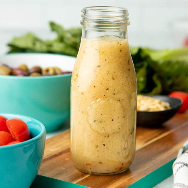 Glass bottle of homemade Italian salad dressing.