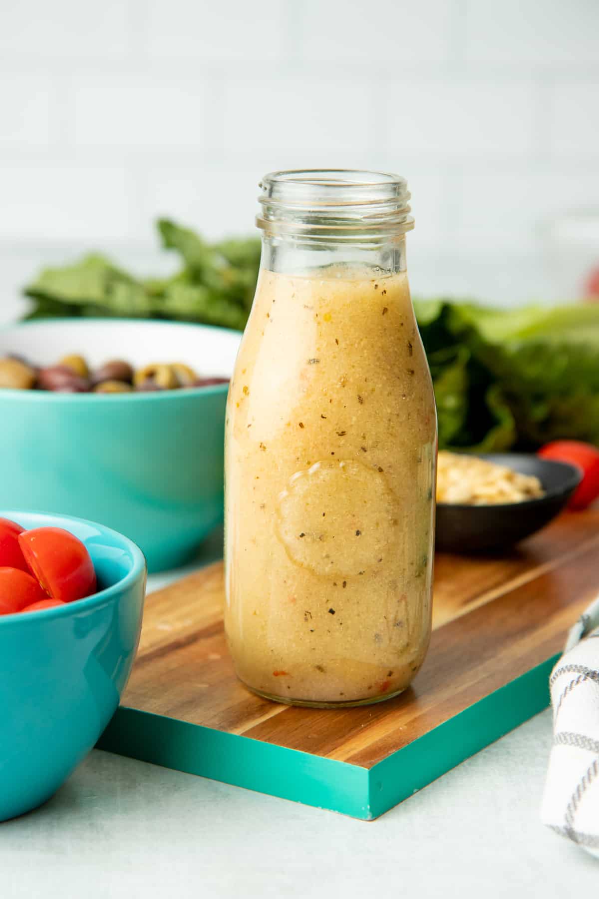 Glass bottle of homemade Italian salad dressing.