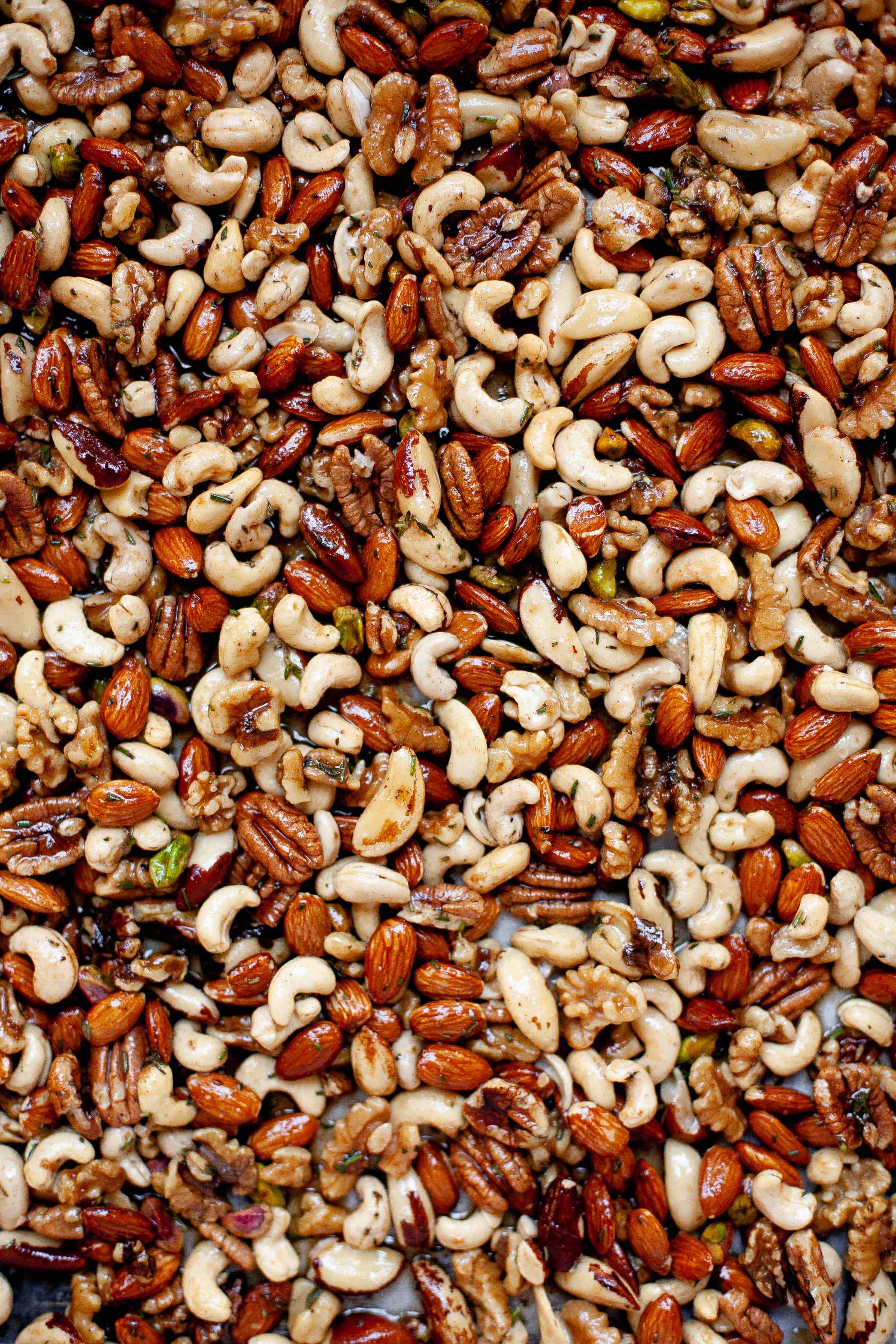 Mixed nuts sprinkled with seasoning and ready for roasting