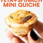 A hand holds up a mini quiche appetizer. A text overlay reads, "Vegetarian Feta + Spinach Mini Quiche."