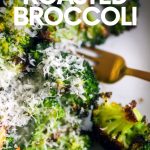 Roasted broccoli topped with parmesan cheese on a white serving dish with a gold fork alongside. A text overlay reads, "Parmesan Roasted Broccoli."