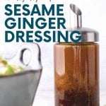 Close up of a glass salad dressing bottle filled with homemade sesame ginger dressing. A text overlay reads, "Easy. Healthy, Cheap. Homemade Sesame Ginger Dressing."