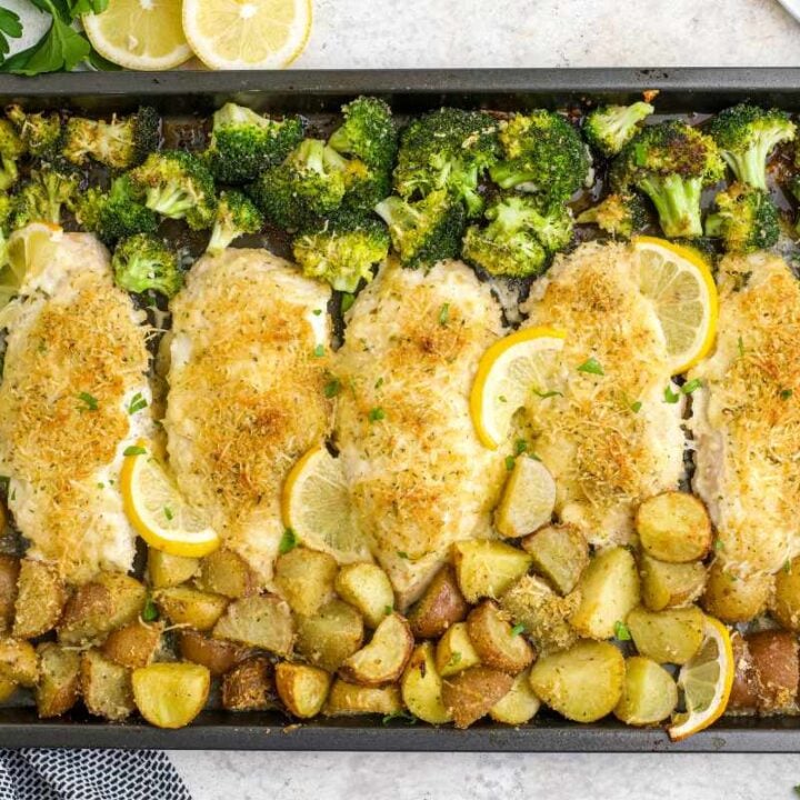 Overhead of a sheet pan chicken dinner with broccoli and potatoes.