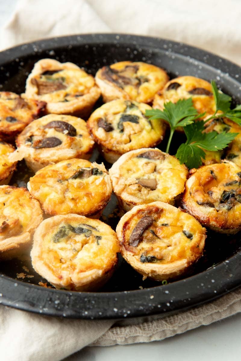 Christmas quiche appetizers on a tray ready to serve.