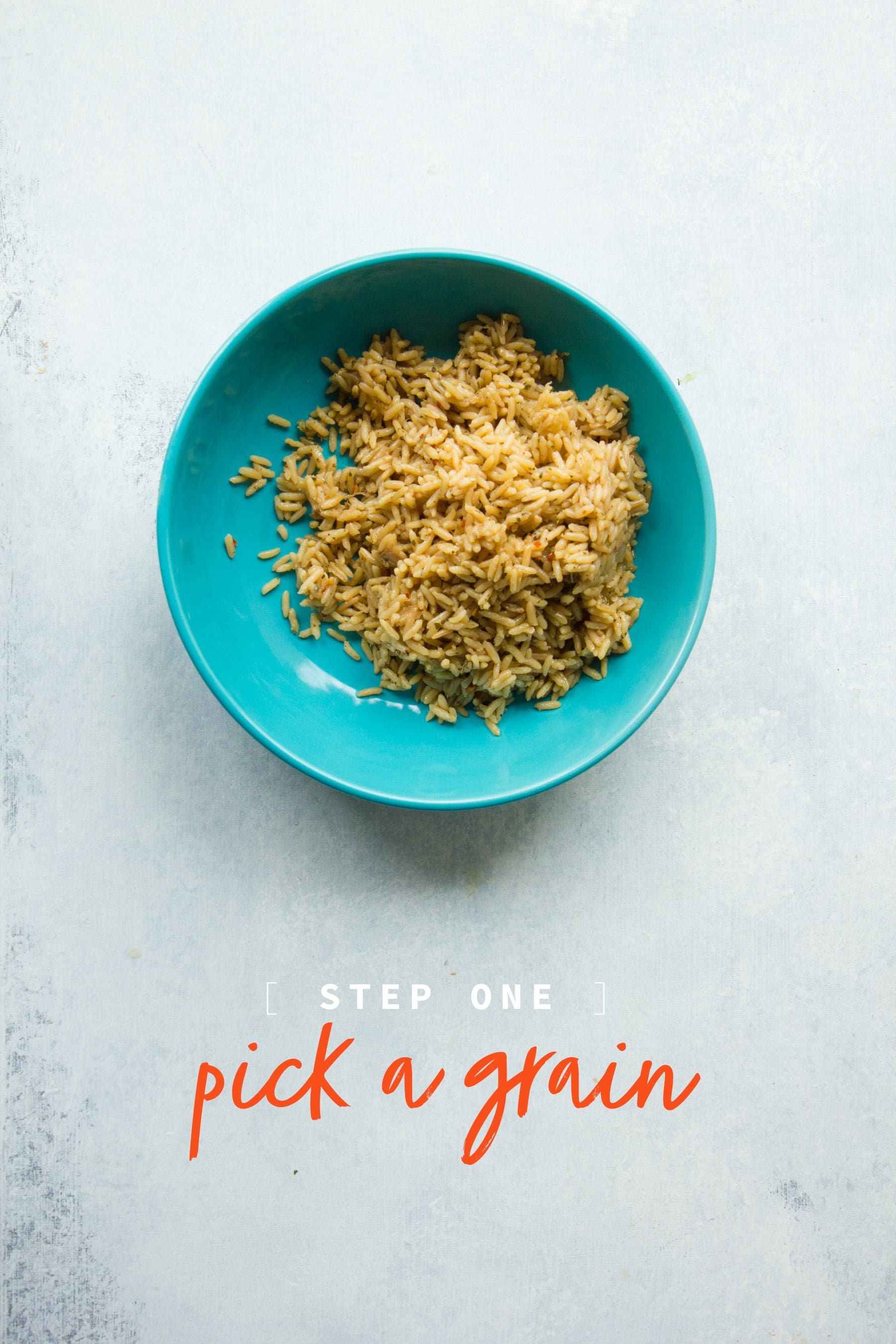 A teal bowl holding brown rice. A text overlay reads "Step 1: Pick a grain"