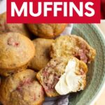 A bowl of strawberry muffins. One muffin is cut in half and smeared with butter. A text overlay reads, "Strawberry Muffins."