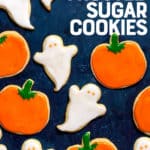 Sugar cookies cut out and frosted to look like ghosts and pumpkins. A text overlay reads "Perfect Frosted Sugar Cookies."