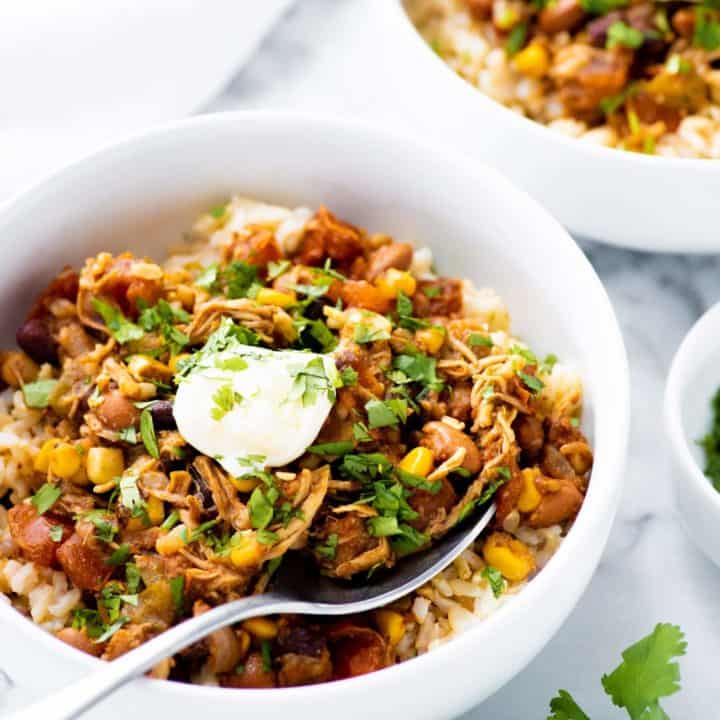 Side angle shot of Slow Cooker Summer Chicken Chili in a white bowl