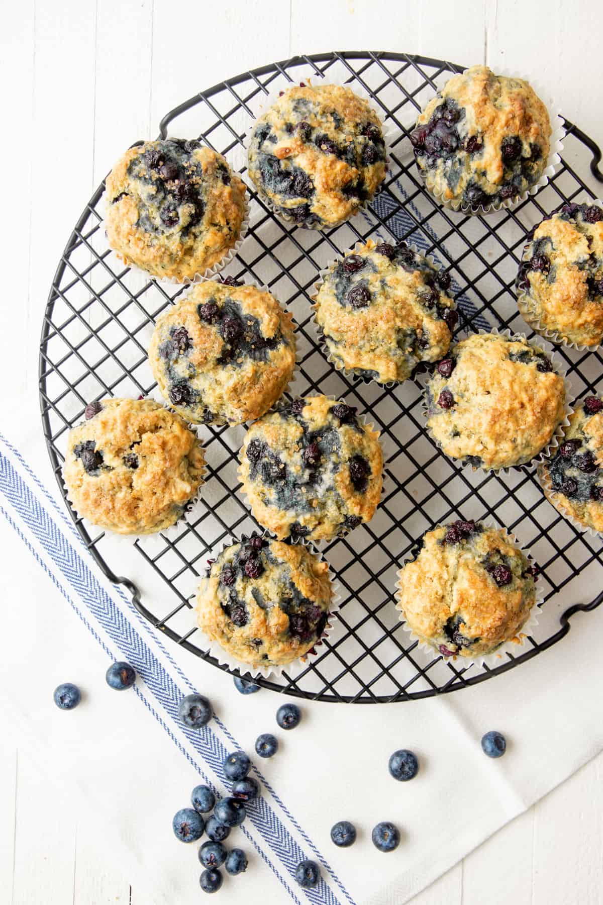 Muffins sit on a cooling rack.